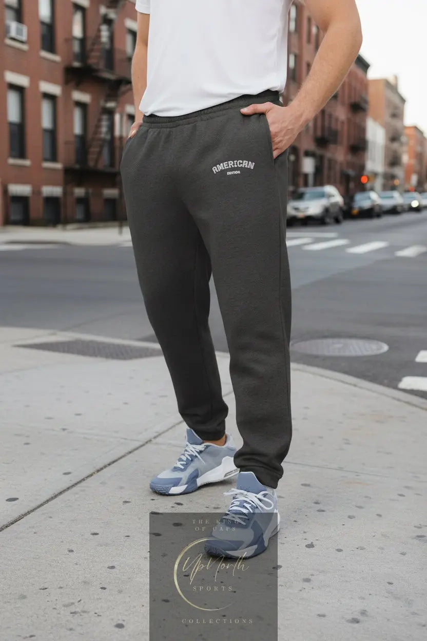 Male model wearing Adidas Joggers American Edition Dark Grey Heather - UpNorth SPORTS