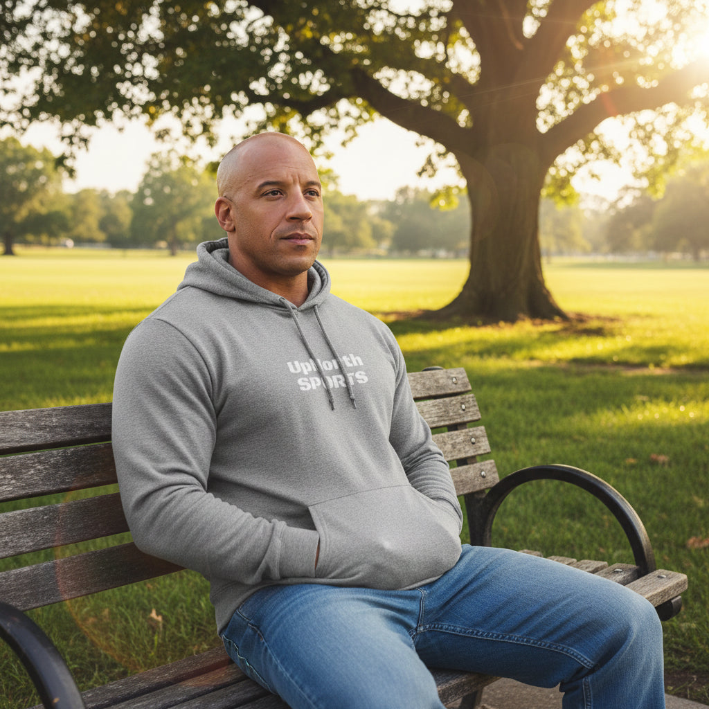 Male model wearing a Grey Heather Premium UpNorthSPORTS Adidas Hoodie - UpNorth SPORTS