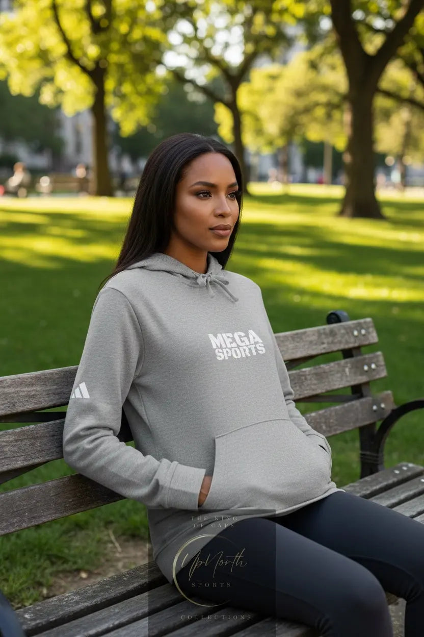 Woman model wearing a Grey Heather Premium MEGASports Adidas Hoodie - UpNorth SPORTS