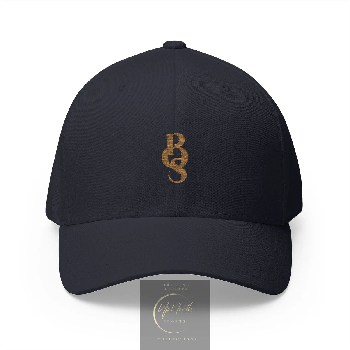 A dark navy blue closed back baseball cap with a gold embroidered POS monogram logo on the front - Paparazzi Original