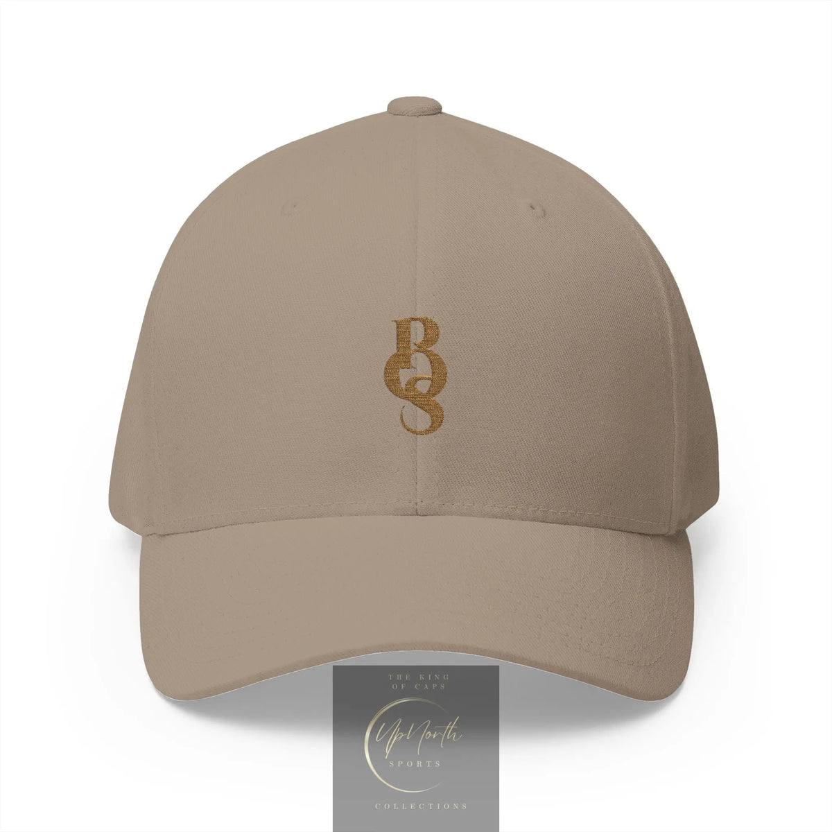 A beige baseball cap with an embroidered gold POS monogram logo on the front - Paparazzi Original