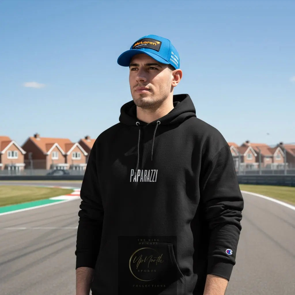Male model wearing a Black Paparazzi Avantgarde Champion Hoodie - Paparazzi Original
