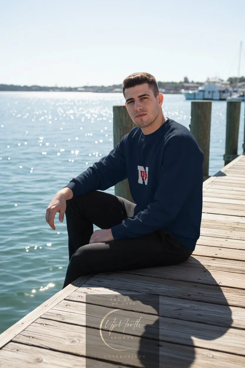 Male model wearing a Navy UpN Red Champion Sweatshirt - UpNorth SPORTS