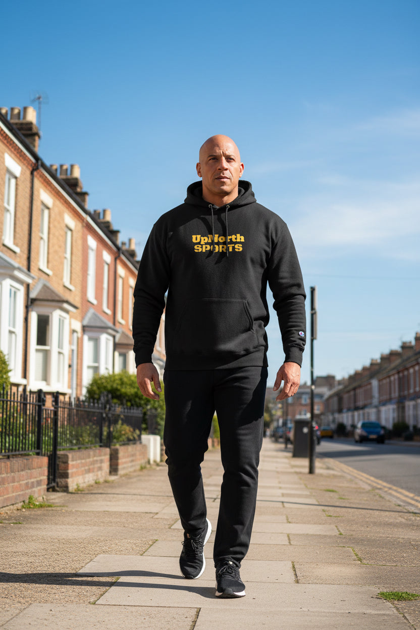 Male model wearing a Black UpNorth Sports Yellow Champion Hoodie - UpNorth SPORTS
