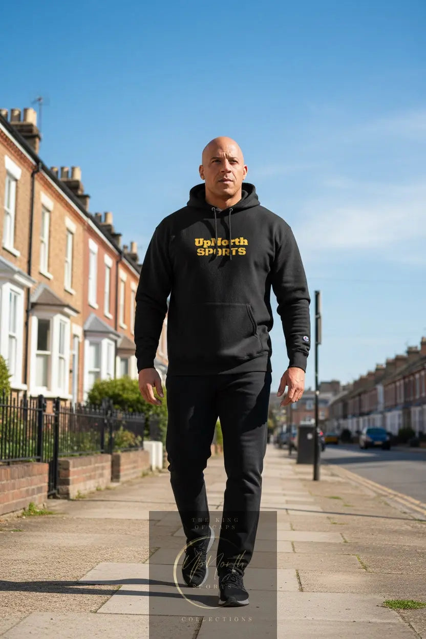 Male model wearing a Black UpNorth Sports Yellow Champion Hoodie - UpNorth SPORTS