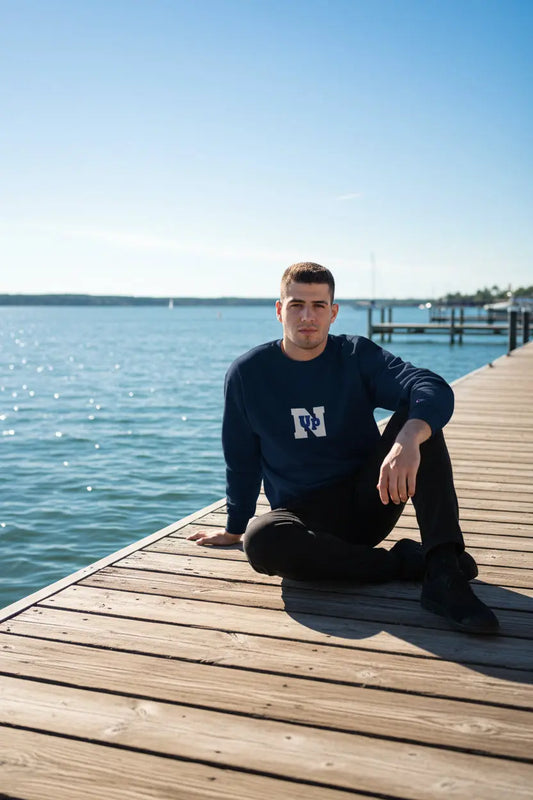 Male model wearing a Navy UpN Champion Sweatshirt - UpNorth SPORTS
