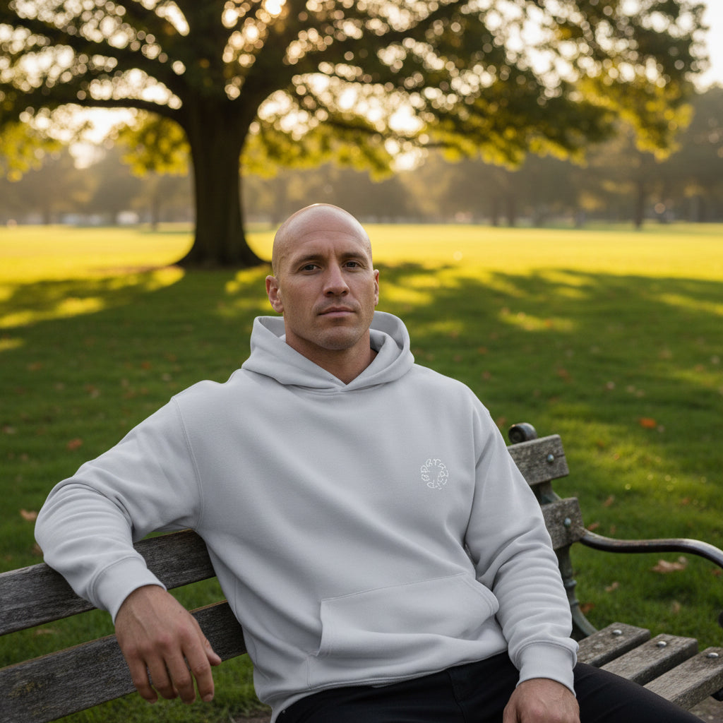 Male model showing off logo on a Powder White Paparazzi Luxury Hoodie - Paparazzi Original
