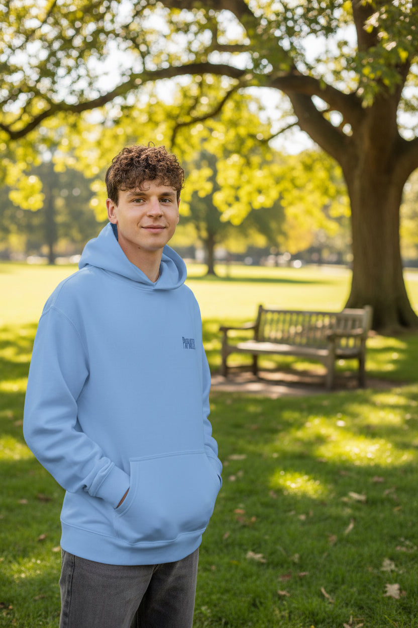 Man wearing a light blue hoodie with a brand logo on a white background