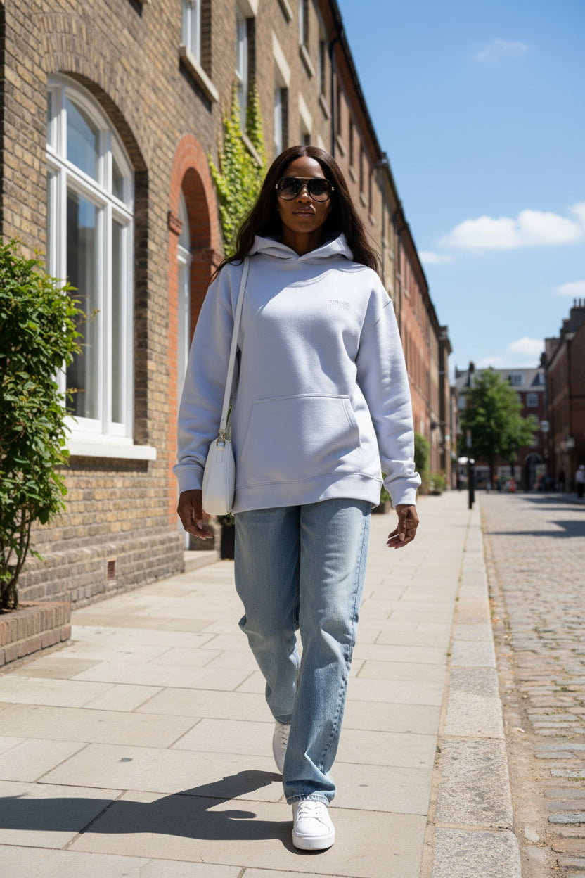 Woman model wearing a White Paparazzi Avantgarde Powder White Hoodie - Paparazzi Original